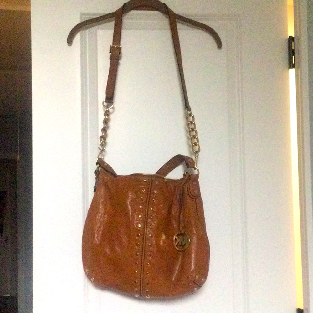 MK crossbody/over the shoulder bag in a camel brown color